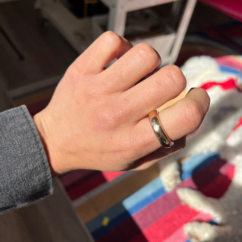 Designer Pomellato 18kt yellow gold band on finger