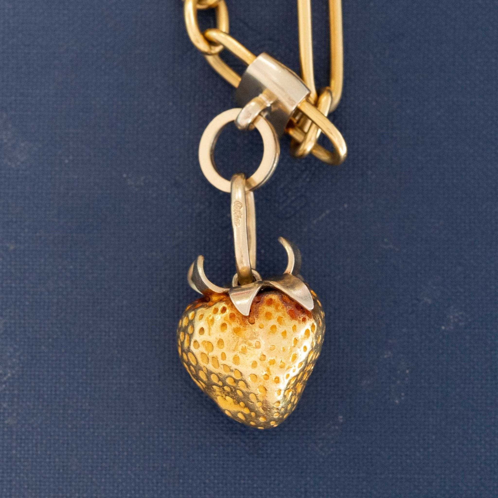 Close-up of Cartier Fruits of Summer fruit charms designed by Aldo Cipullo