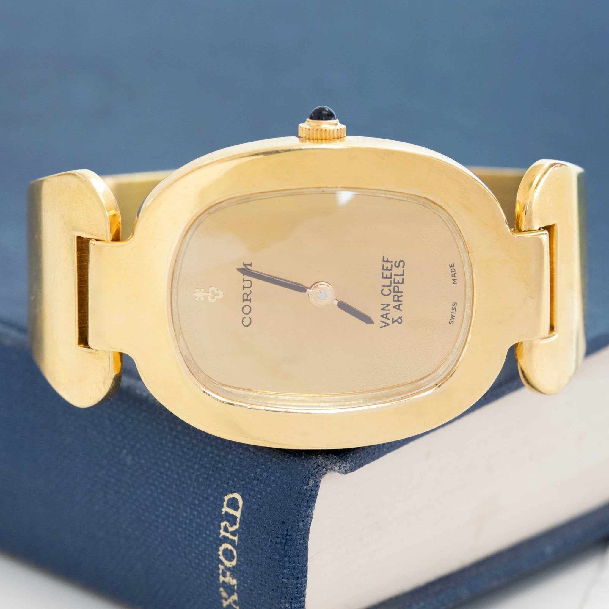 Sculptural VCA Corum wristwatch in yellow gold