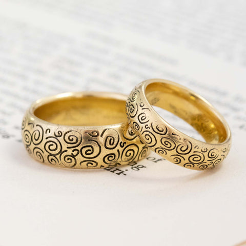 Matching 18kt yellow gold wedding band set of Swirl band by Designer MC Paris. 