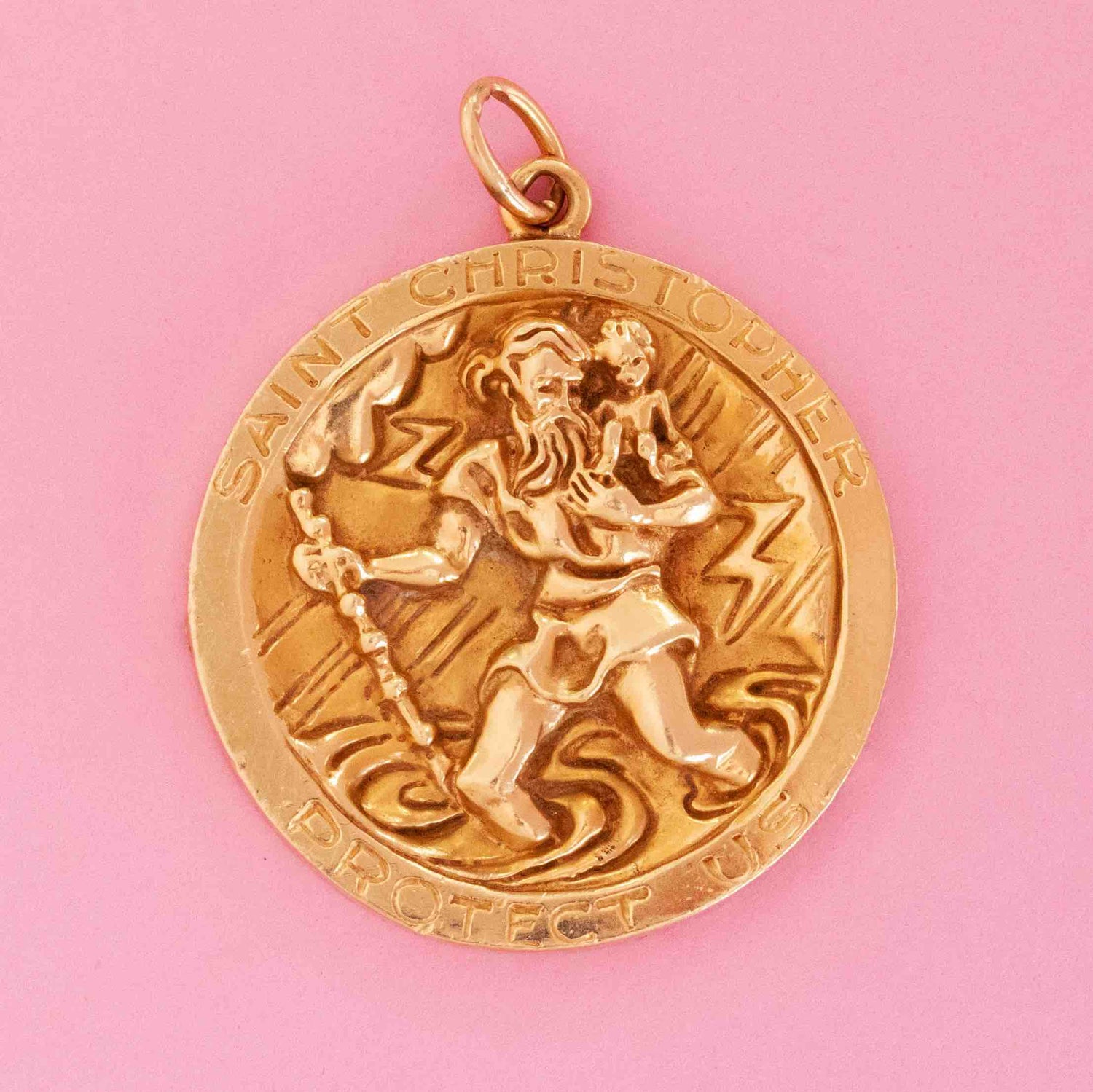 Vintage Tiffany & Co. St. Christopher pendant in 14kt yellow gold with engraved message on pink background