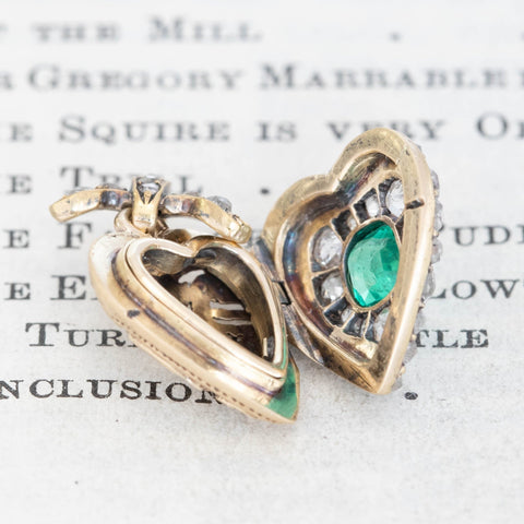 Antique gold heart locket with emerald center