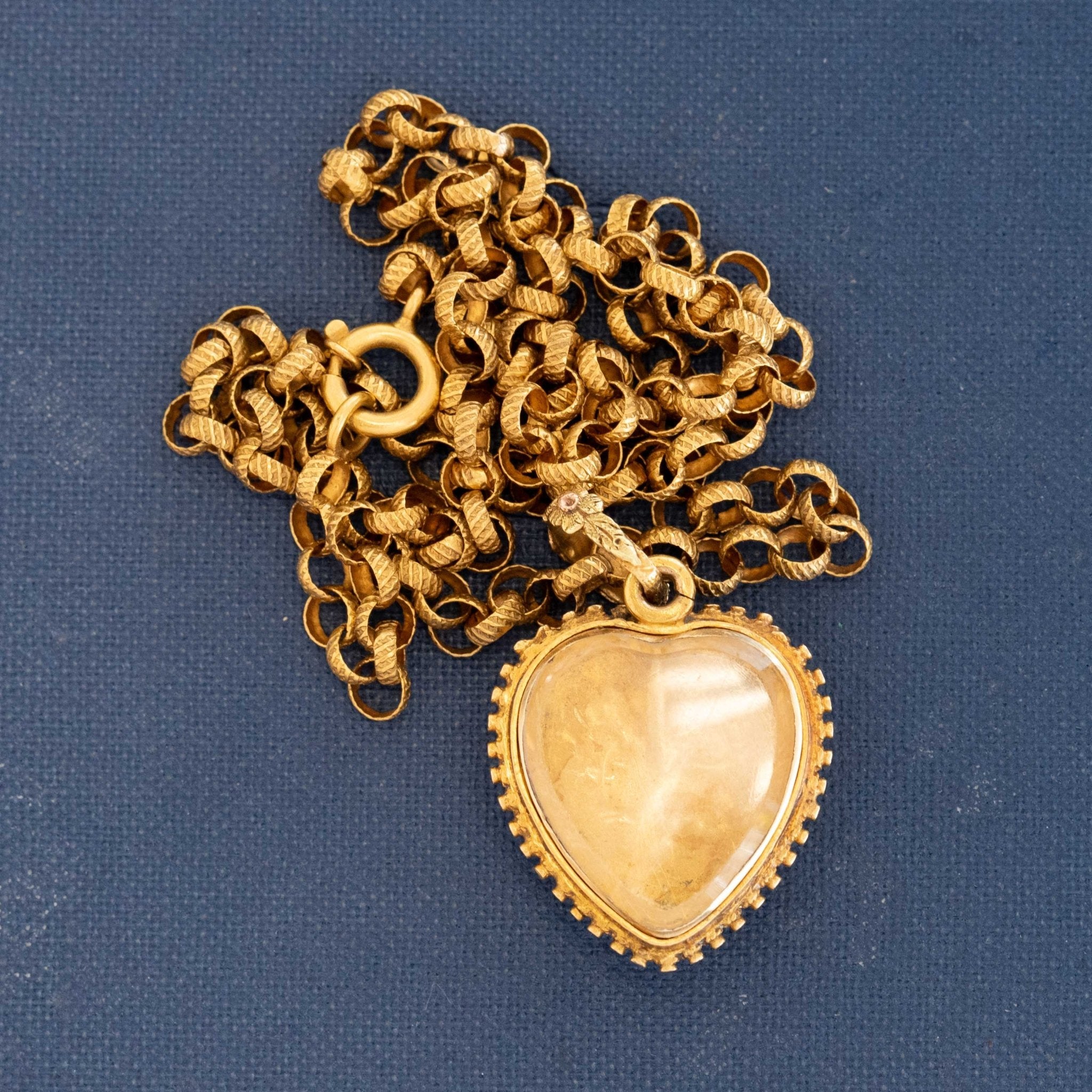 Rare Victorian gem set heart pendant in 18k gold with repoussé floral design