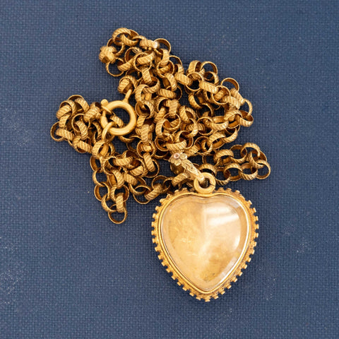 Rare Victorian gem set heart pendant in 18k gold with repoussé floral design