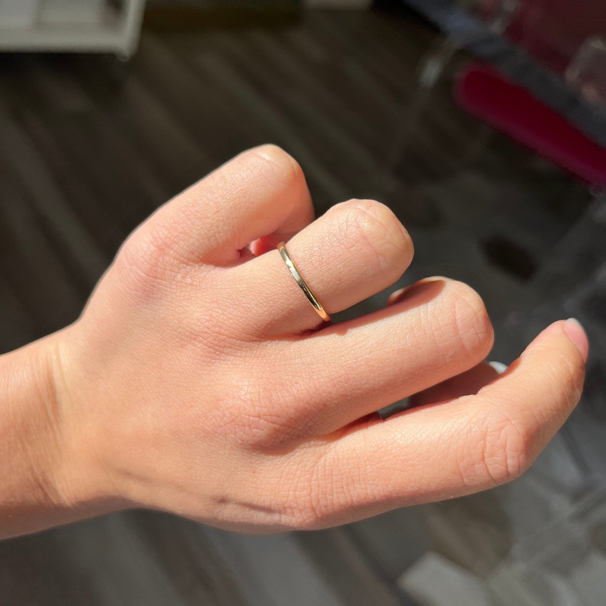 vintage gold wedding band on finger
