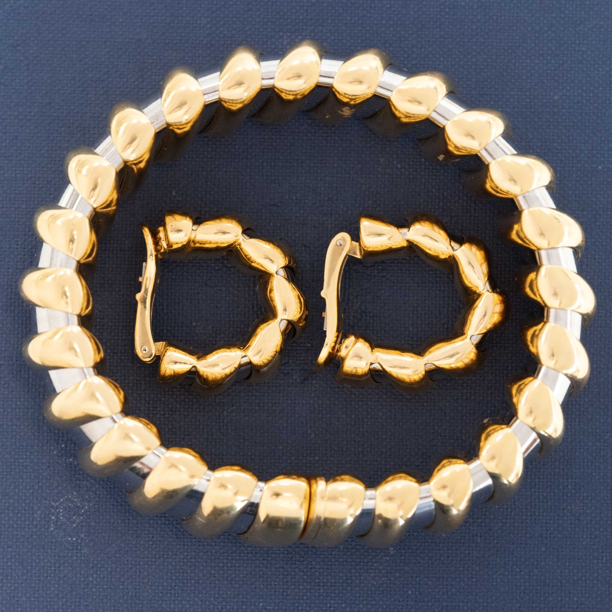 Sculptural Bulgari Tubogas hoops with twisted gold design