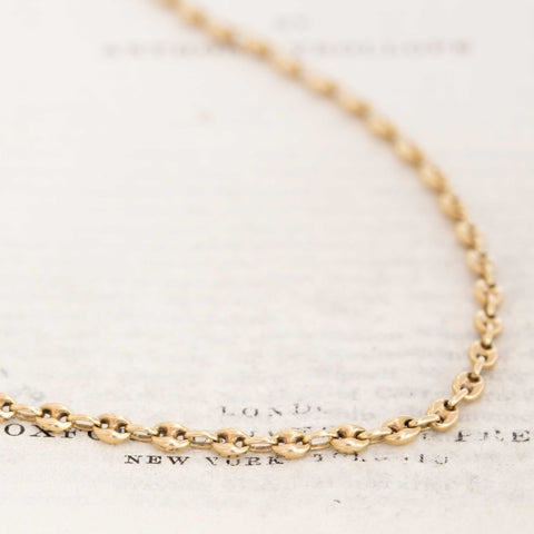 Vintage 14k yellow gold mariner link chain necklace on white background