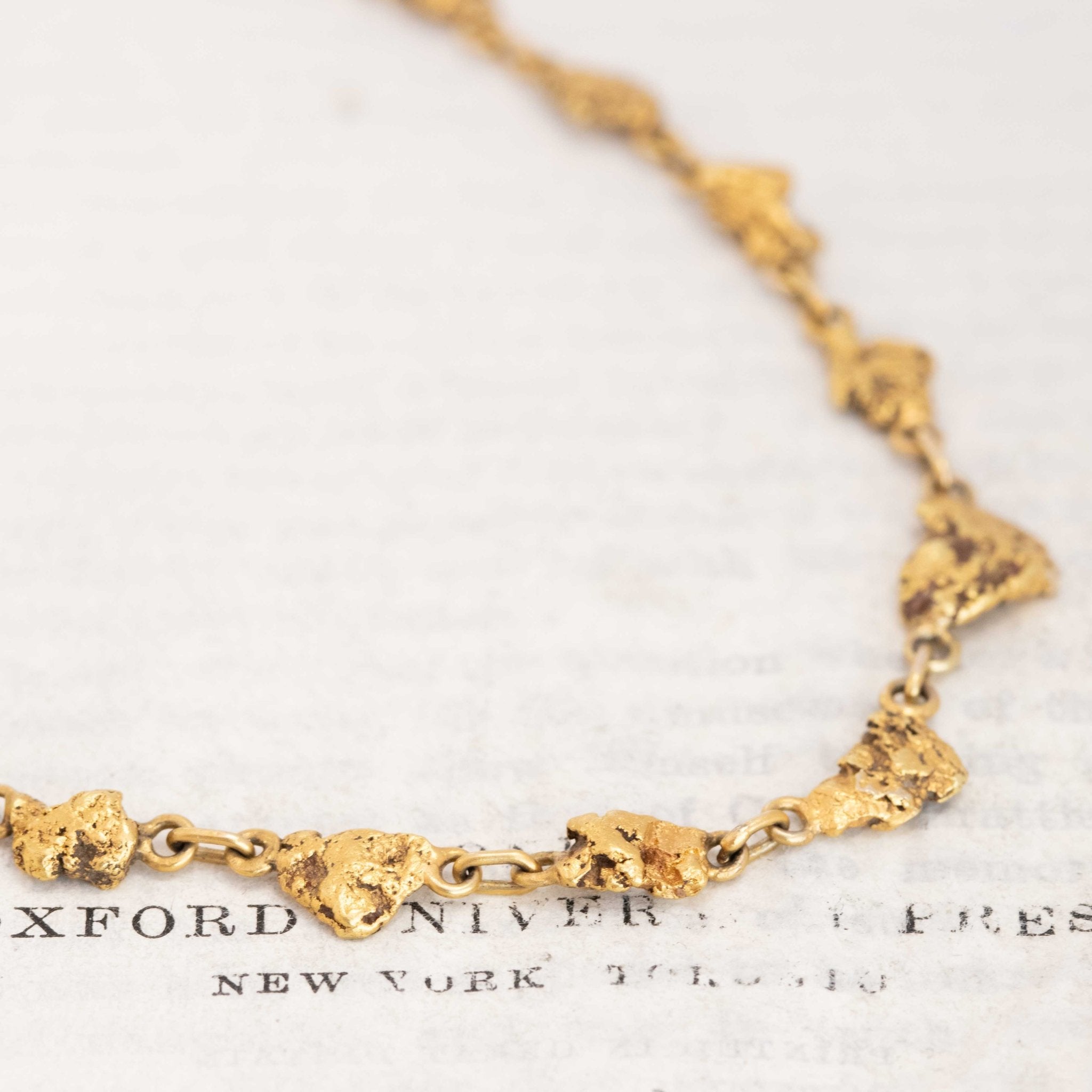 Vintage gold nugget chain close-up, artisanal craftsmanship