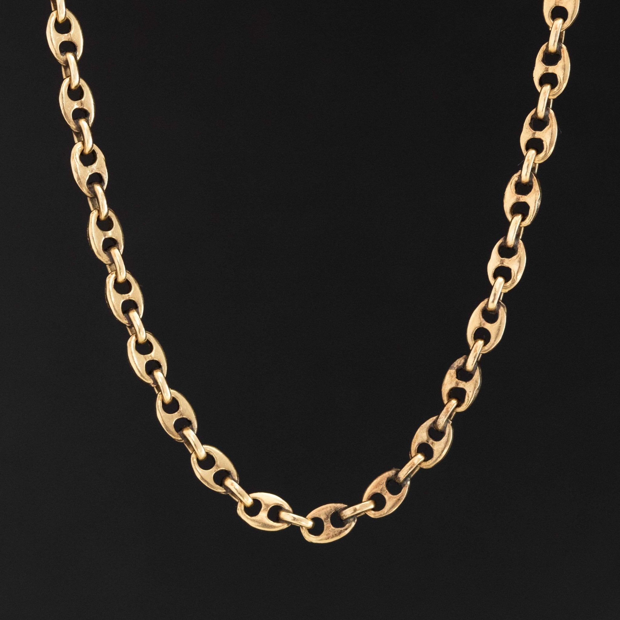 Vintage 14k yellow gold 30-inch mariner link chain necklace on white background

Long 14kt yellow gold mariner link chain, 3.25mm wide, vintage design