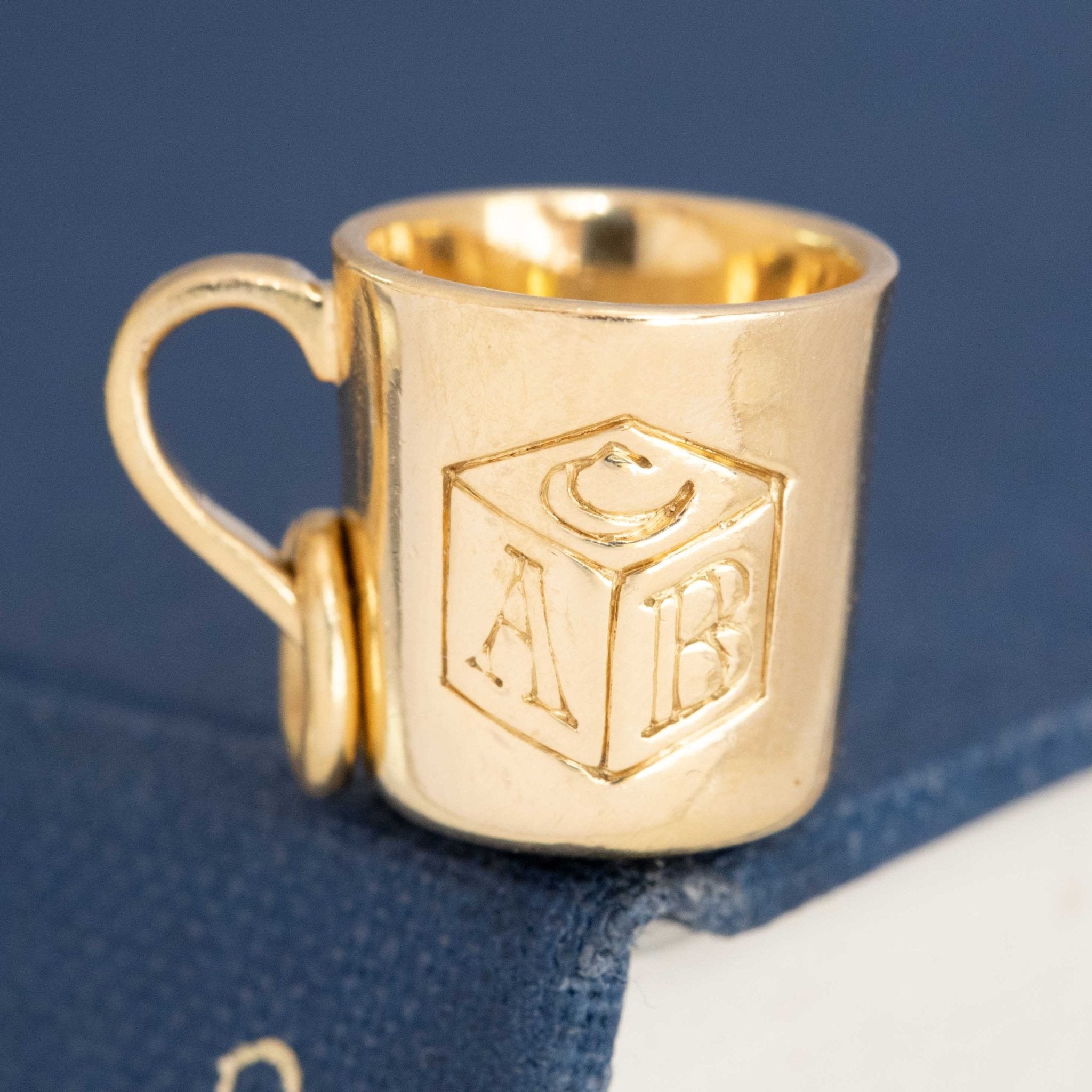 Vintage Tiffany &amp; Co. yellow gold baby cup charm with engraved ABC block motif.
