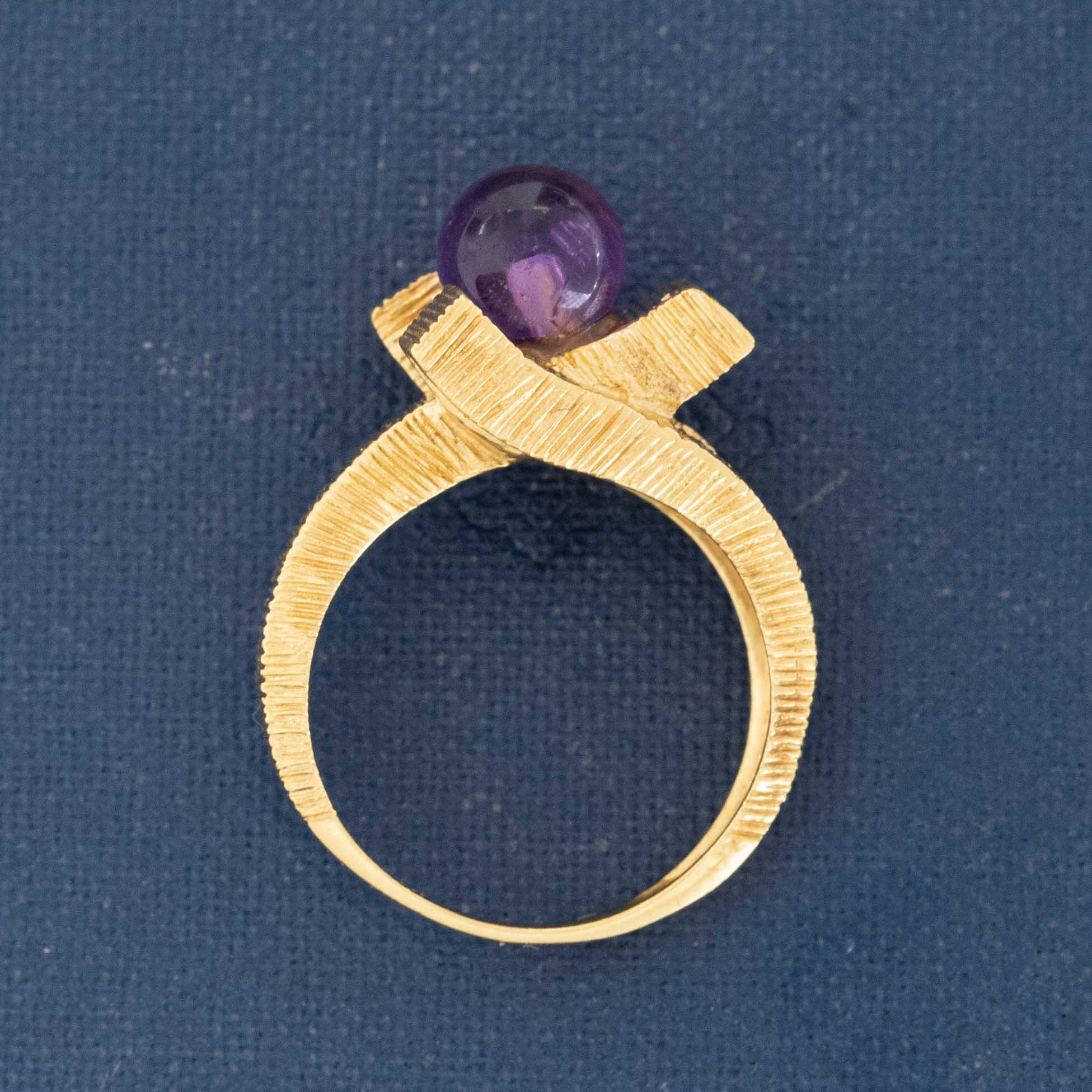 1960s–70s sculptural gold ring with amethyst cabochon bead