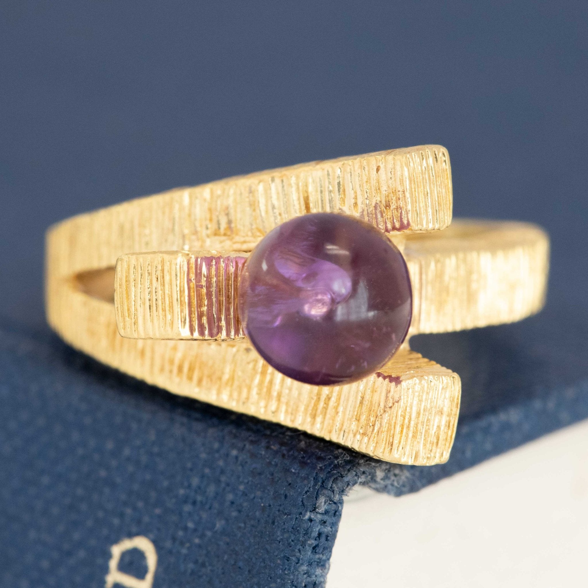 Vintage sculptural gold ring with amethyst bead