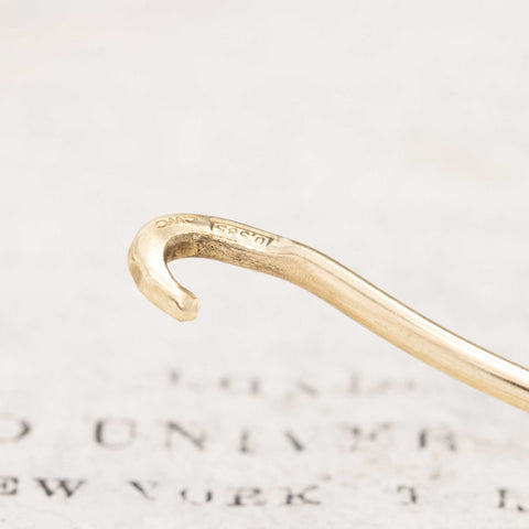 Delicate gold bangle watch featuring Tiffany & Co. dial