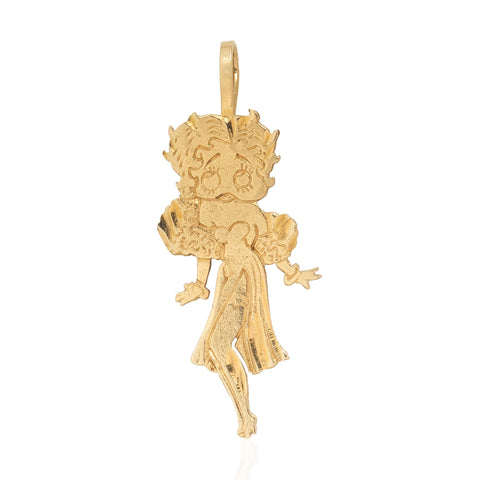 A vintage gold pendant charm shaped like cartoon character, Betty Boop, shown on a plain white background.