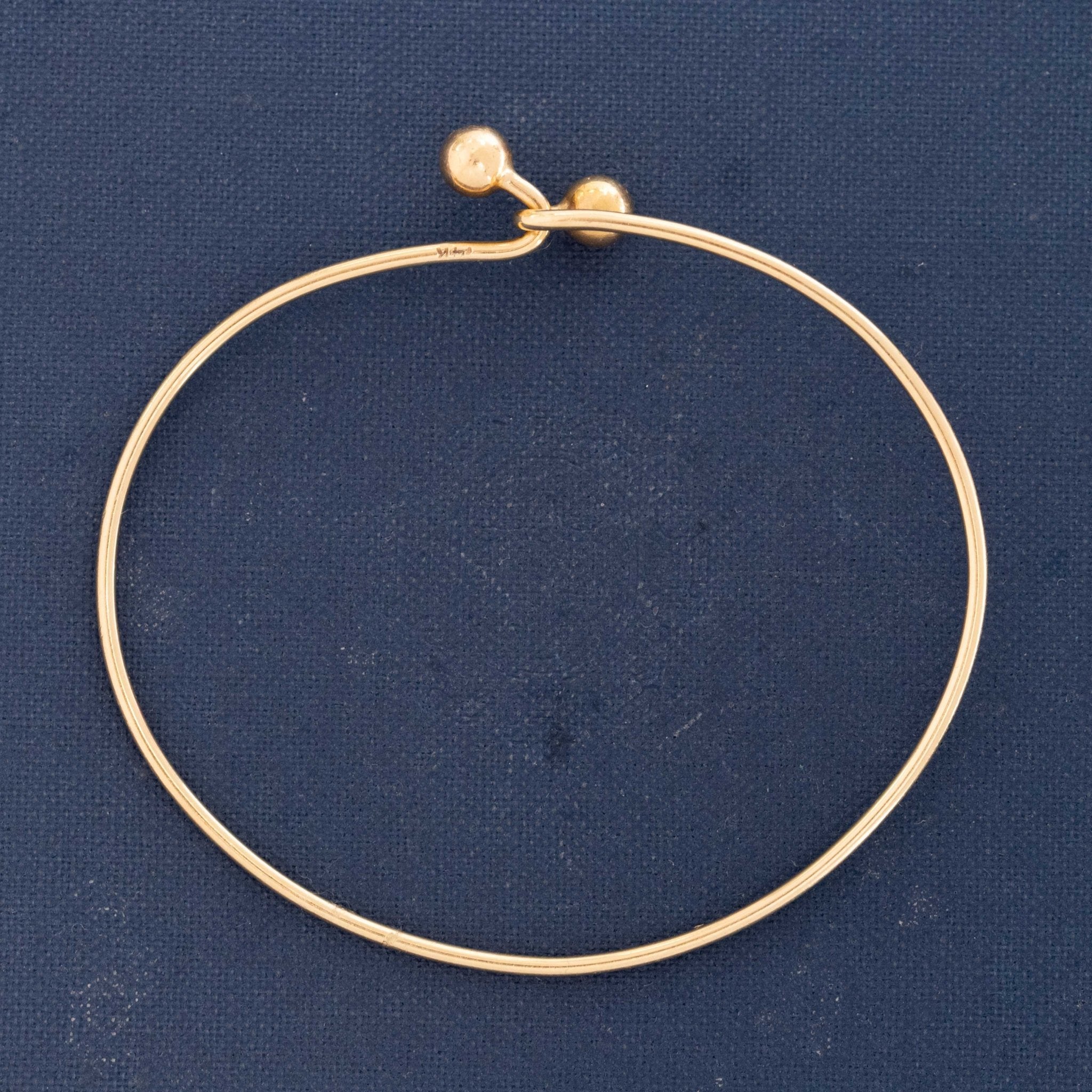 Minimal gold open bracelet with modernist design