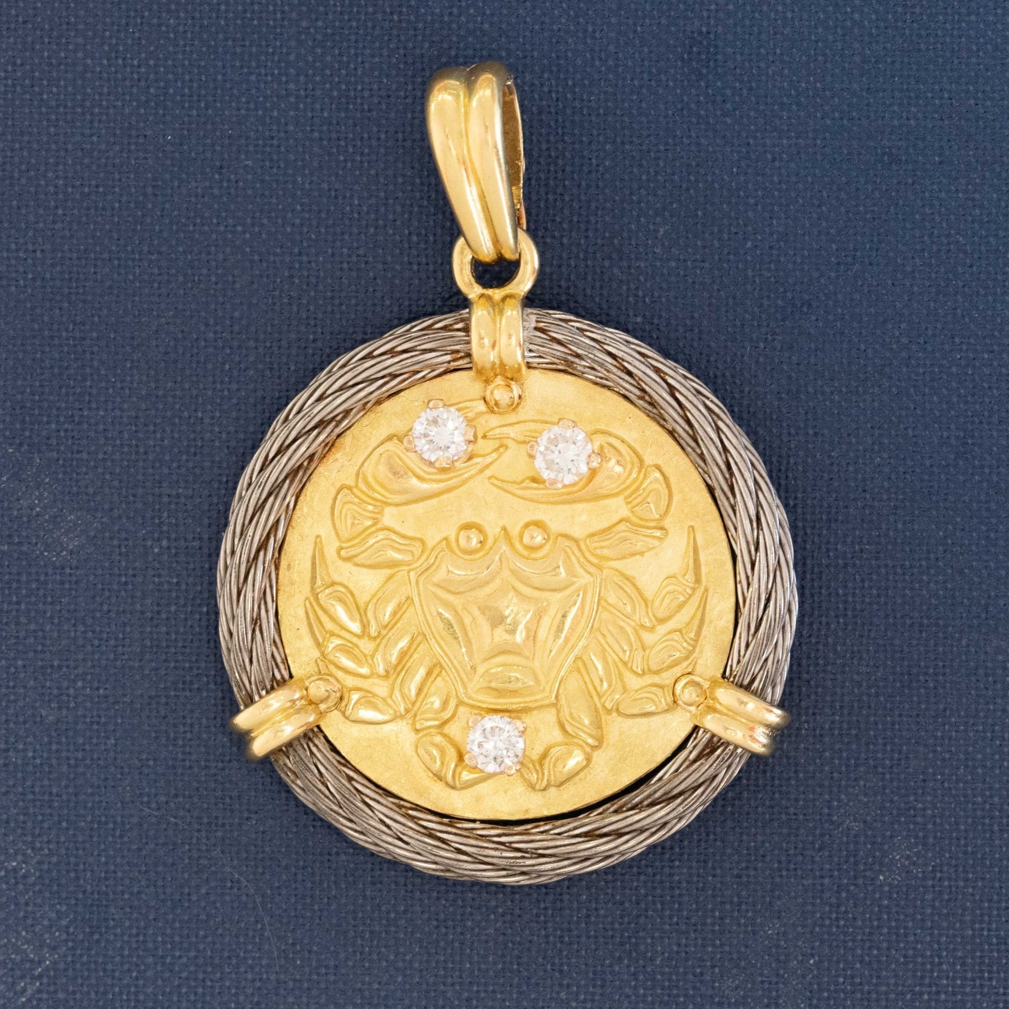 Vintage Fred Paris Cancer zodiac pendant in 18K yellow gold with diamond accents and rope-style white gold border.