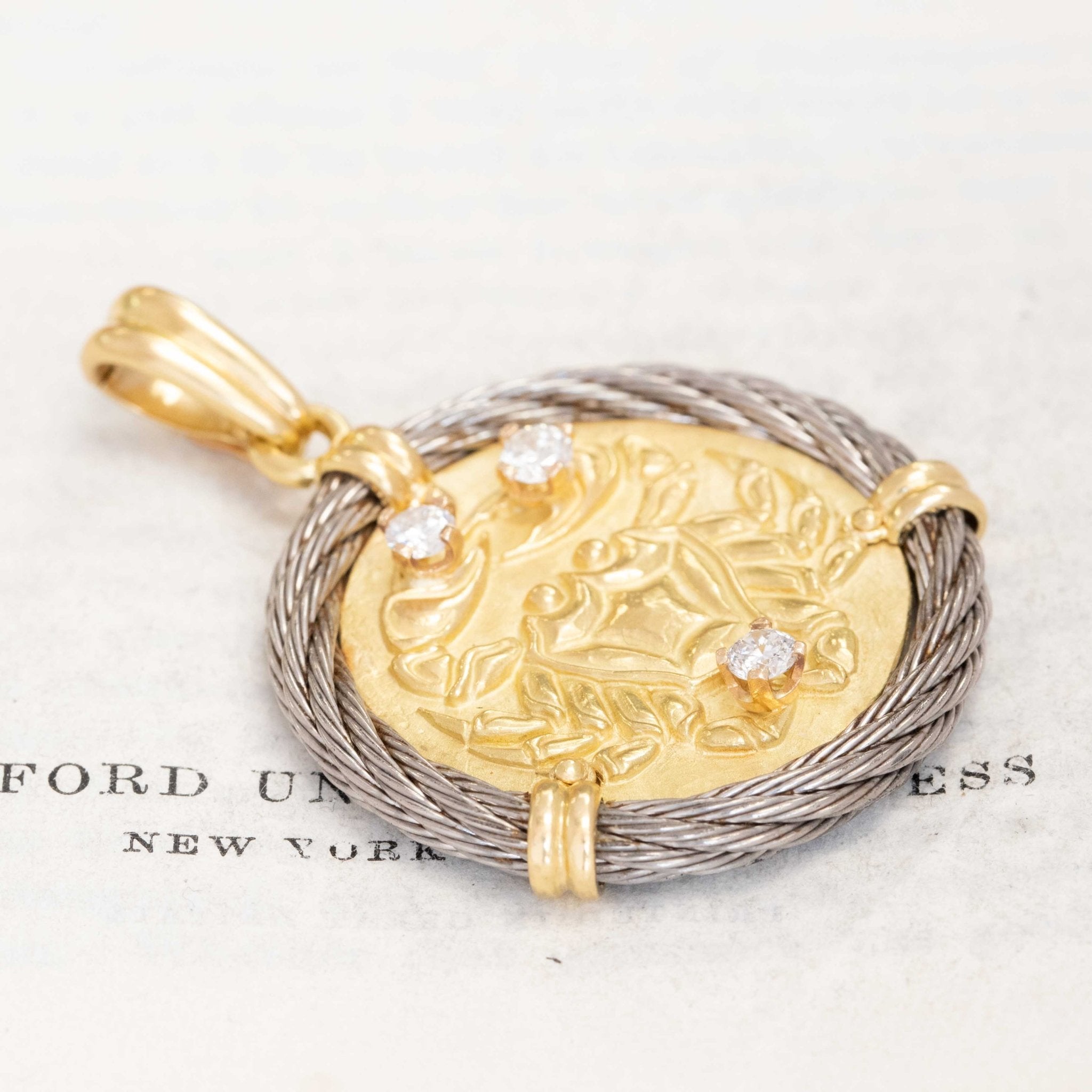 Astrology-inspired vintage Cancer zodiac pendant in gold with sparkling diamonds and textured rope border, designed by Fred Paris.

Luxury vintage Fred Paris Cancer zodiac charm, 18K gold and diamond accents, perfect astrology jewelry for collectors