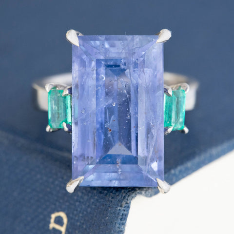 Natural color change sapphire with vibrant emerald accents