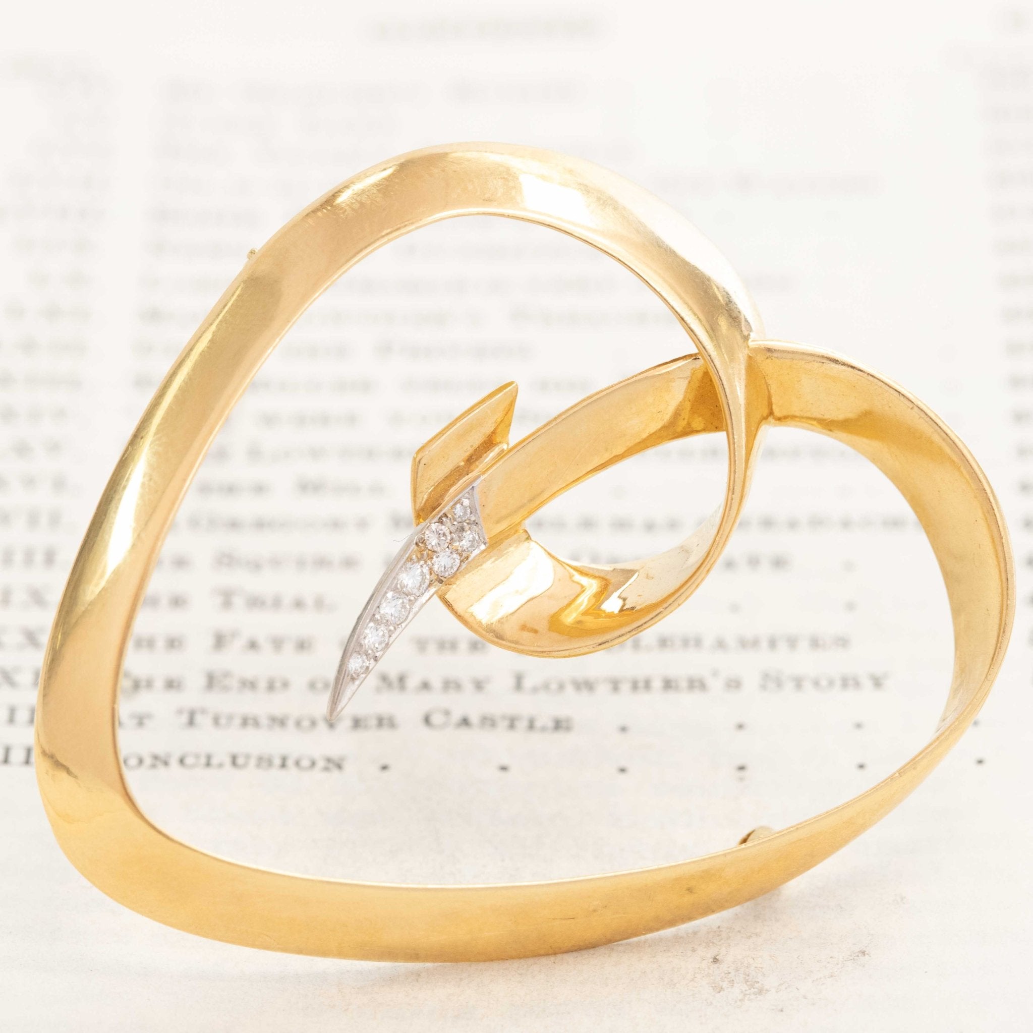 Vintage gold heart brooch by Paloma Picasso with diamond center