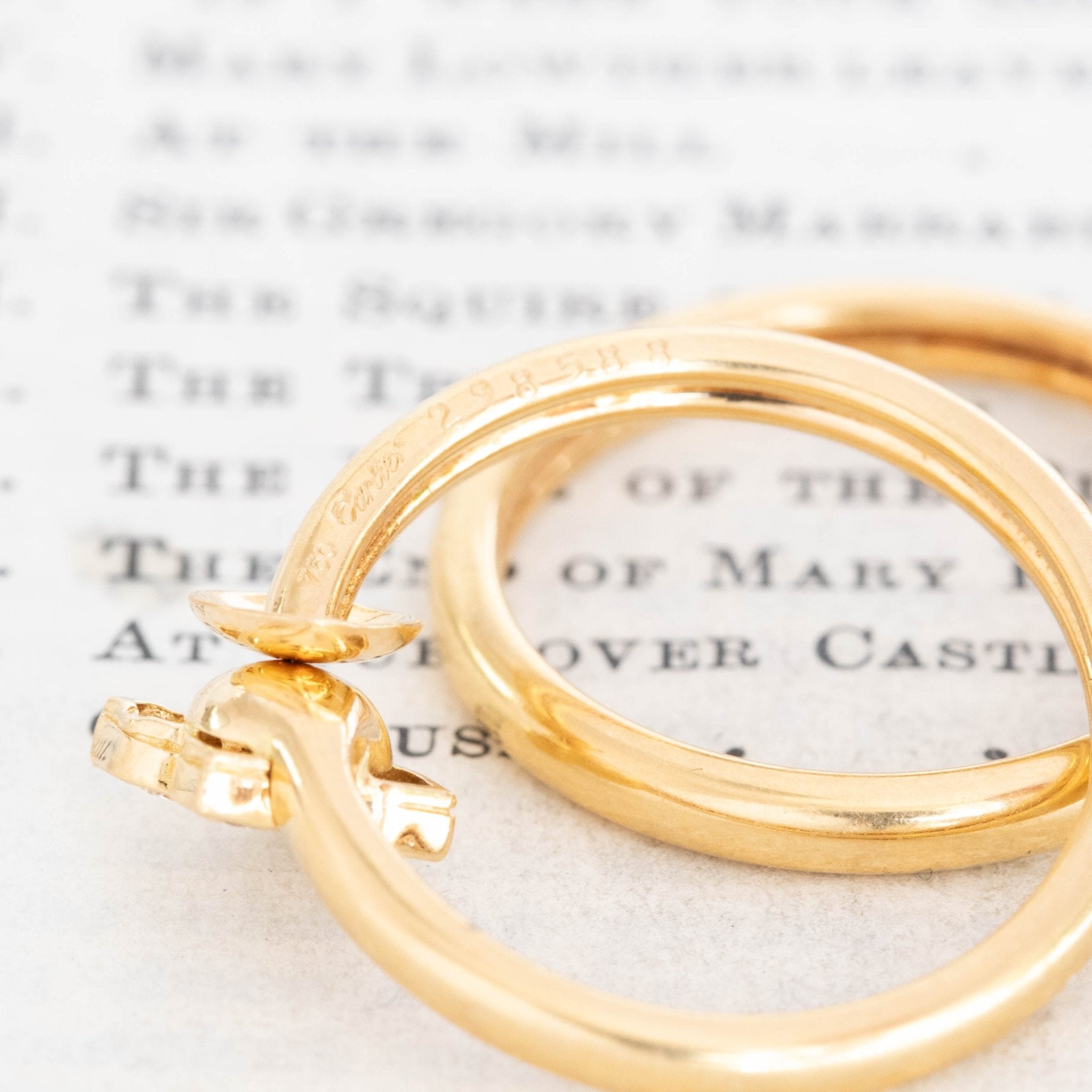 Yellow gold Cartier hoops with diamond lotus tops