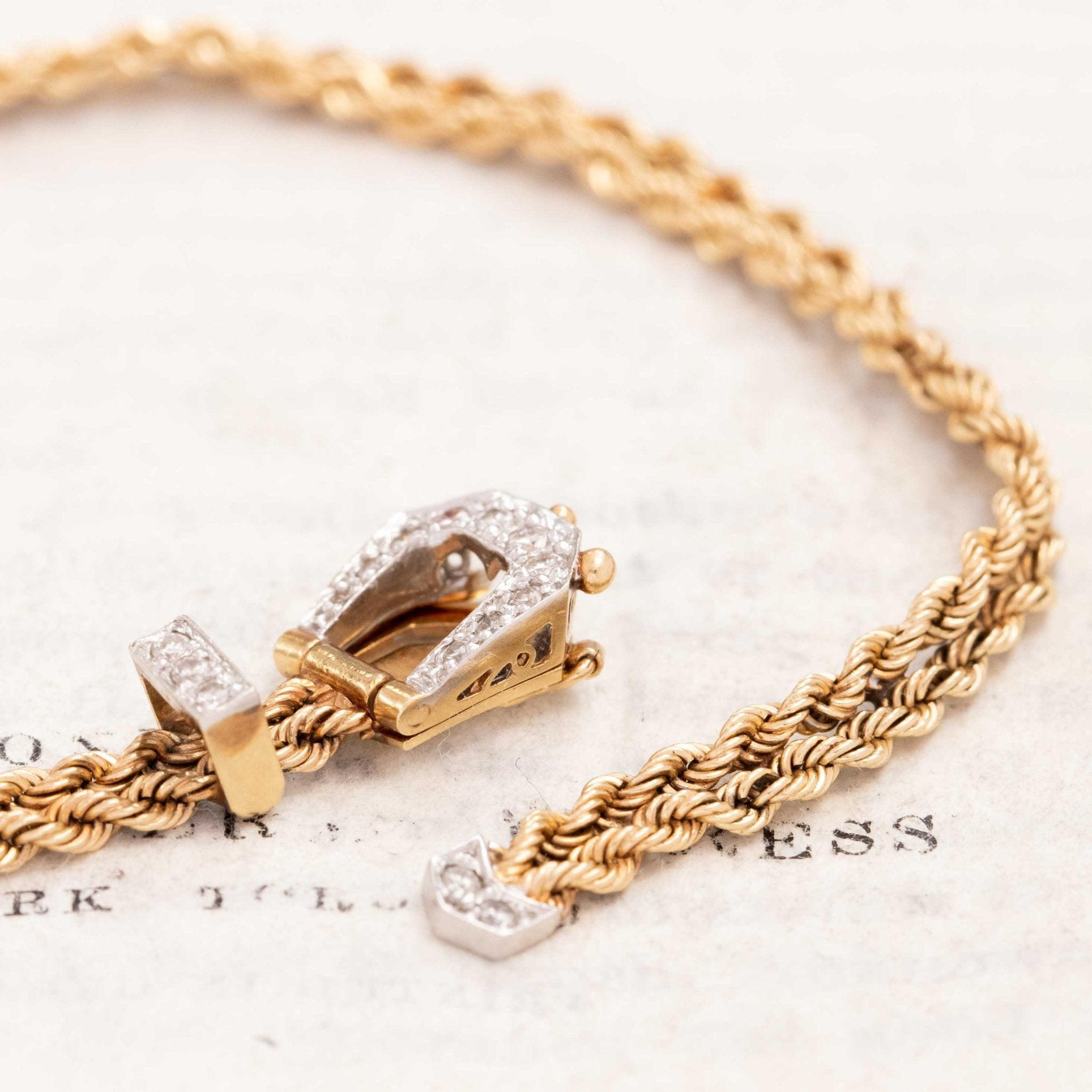 Gold buckle bracelet with diamond accents
