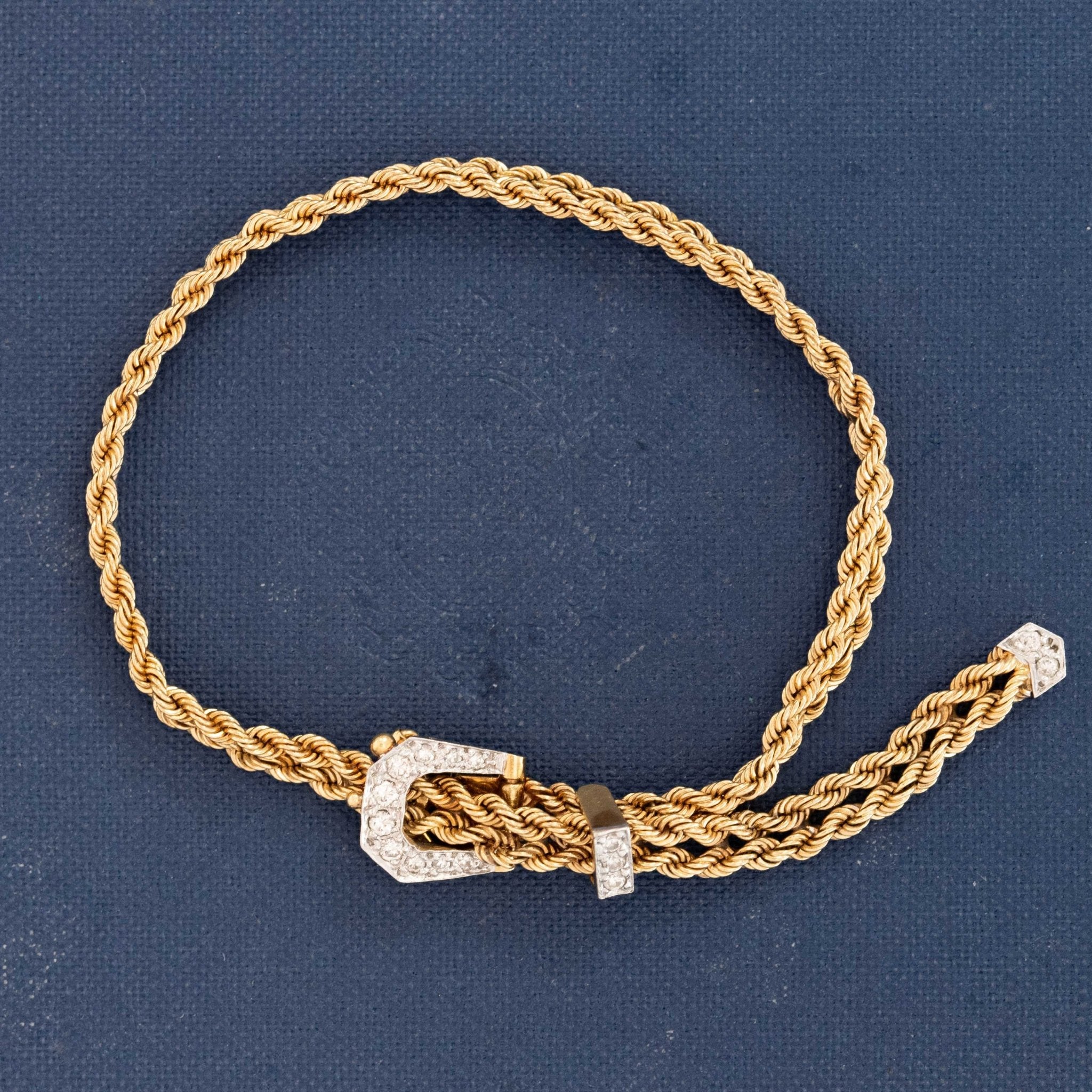 Vintage diamond mesh buckle bracelet in 18k gold, flexible woven design with diamond accents