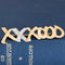 Vintage Tiffany Paloma Picasso XXXOOO brooch in gold with diamond X detail