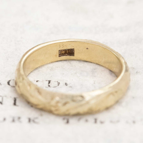 Classic 14kt antique gold etched wedding band, timeless design.