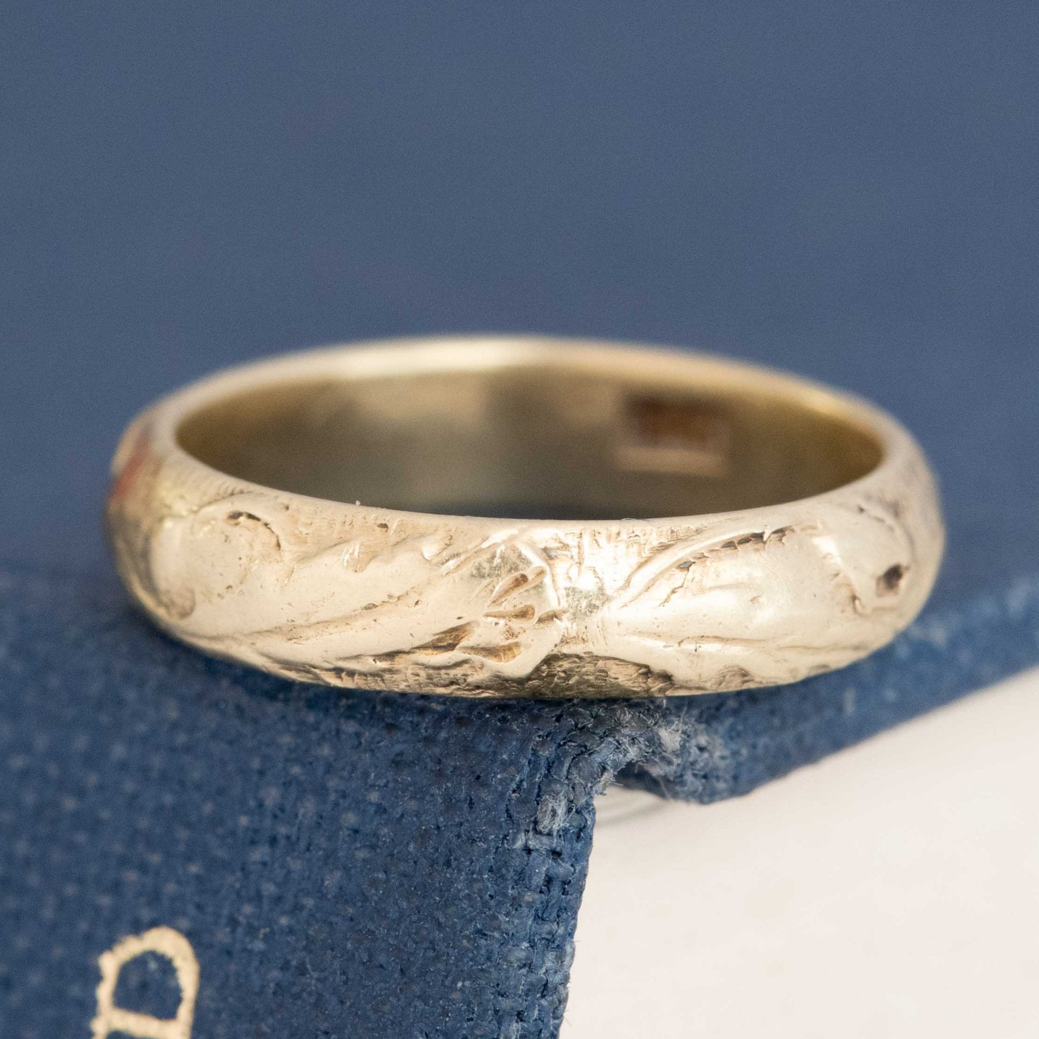 Vintage 14kt yellow gold etched wedding band with rich patina and timeless design.