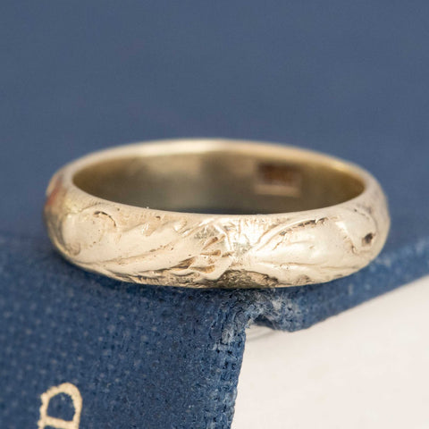 Vintage 14kt yellow gold etched wedding band with rich patina and timeless design.