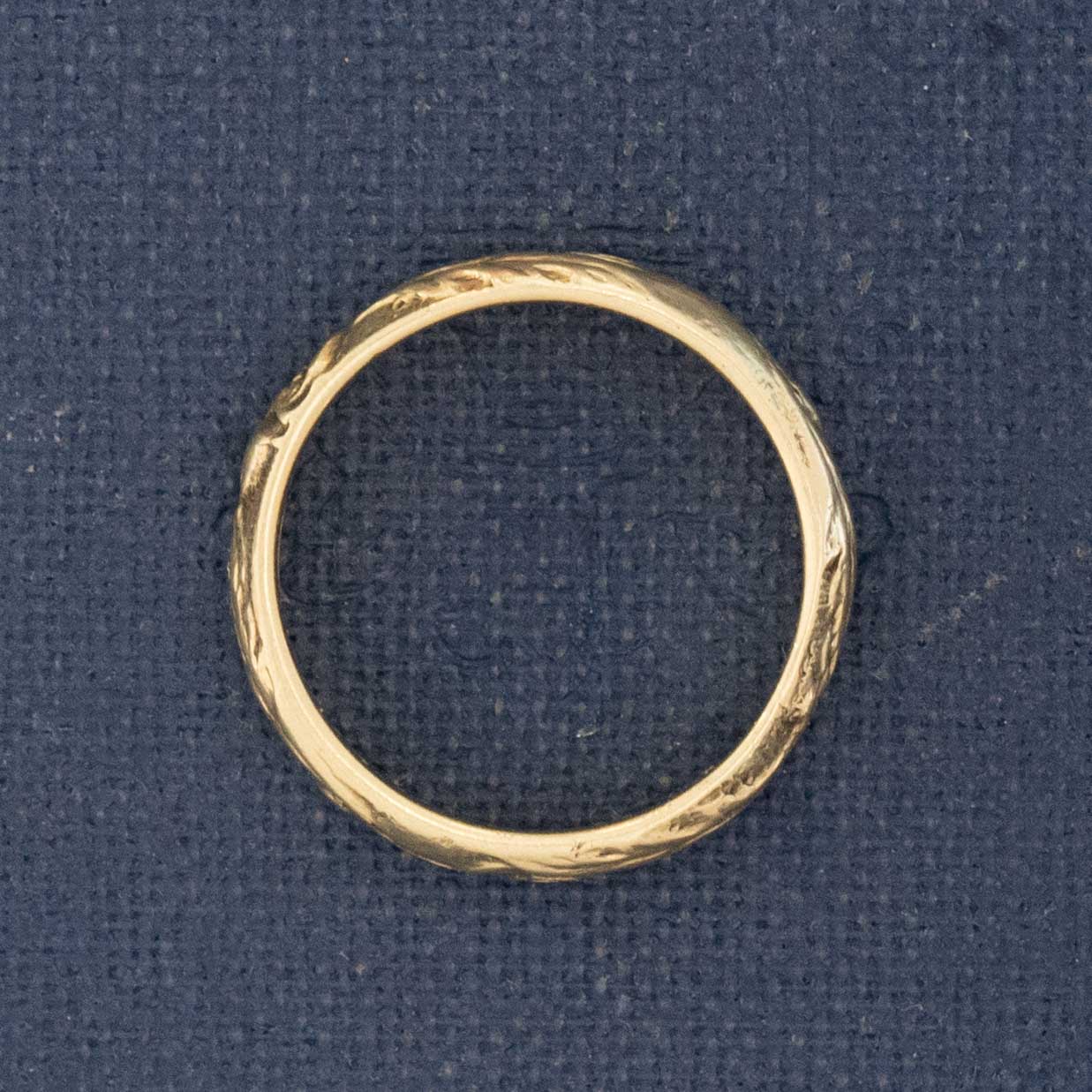 Side profile of vintage heirloom-jewelry 14kt gold wedding band with history.