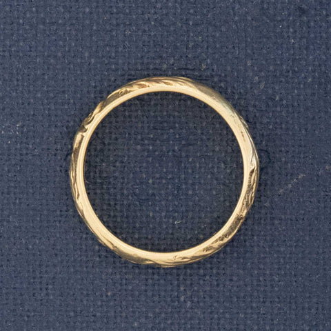 Side profile of vintage heirloom-jewelry 14kt gold wedding band with history.