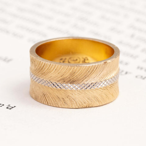 14kt yellow gold feather and cross hatch wedding band with a rhodium plated center cross hatch