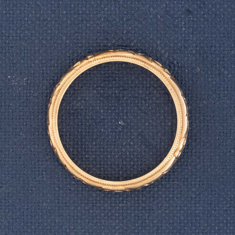 Side profile of Romantic and classic 14kt gold band, antique wedding jewelry.