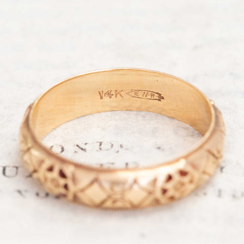 Antique 14kt gold wedding band with subtle handcrafted details.