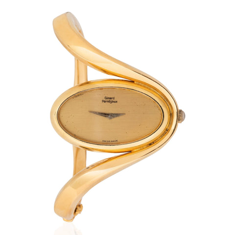Vintage 1970s Girard-Perregaux 18K yellow gold oval dial freeform bangle watch