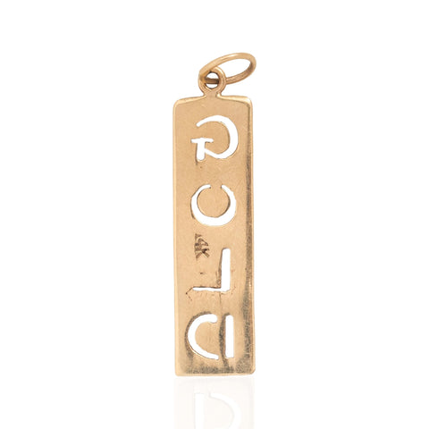 The backside of a vertical rectangular vintage gold pendant with cutout letters spelling 'GOLD' vertically, shown on a clean white background with a subtle reflection.