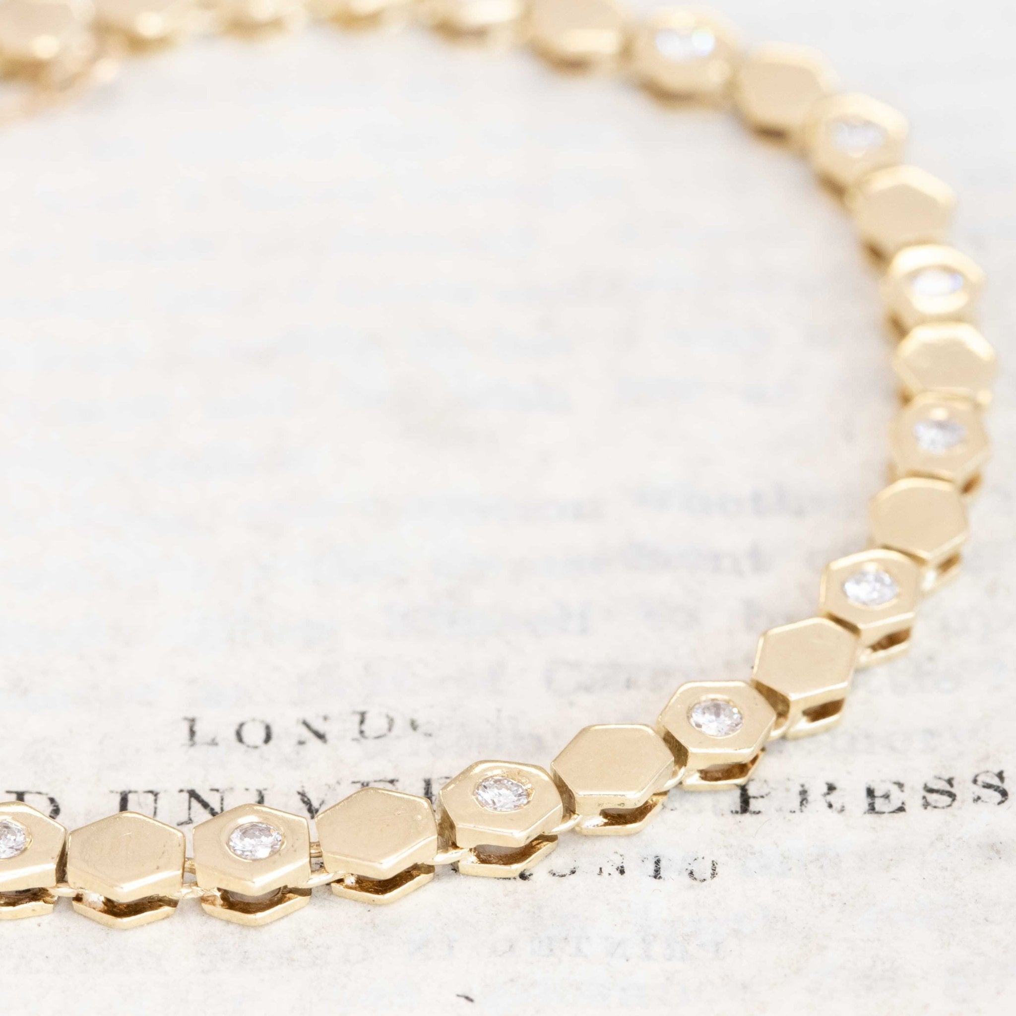 Diamond bracelet in yellow gold, hexagon link design, fits up to 7.5-inch wrist.