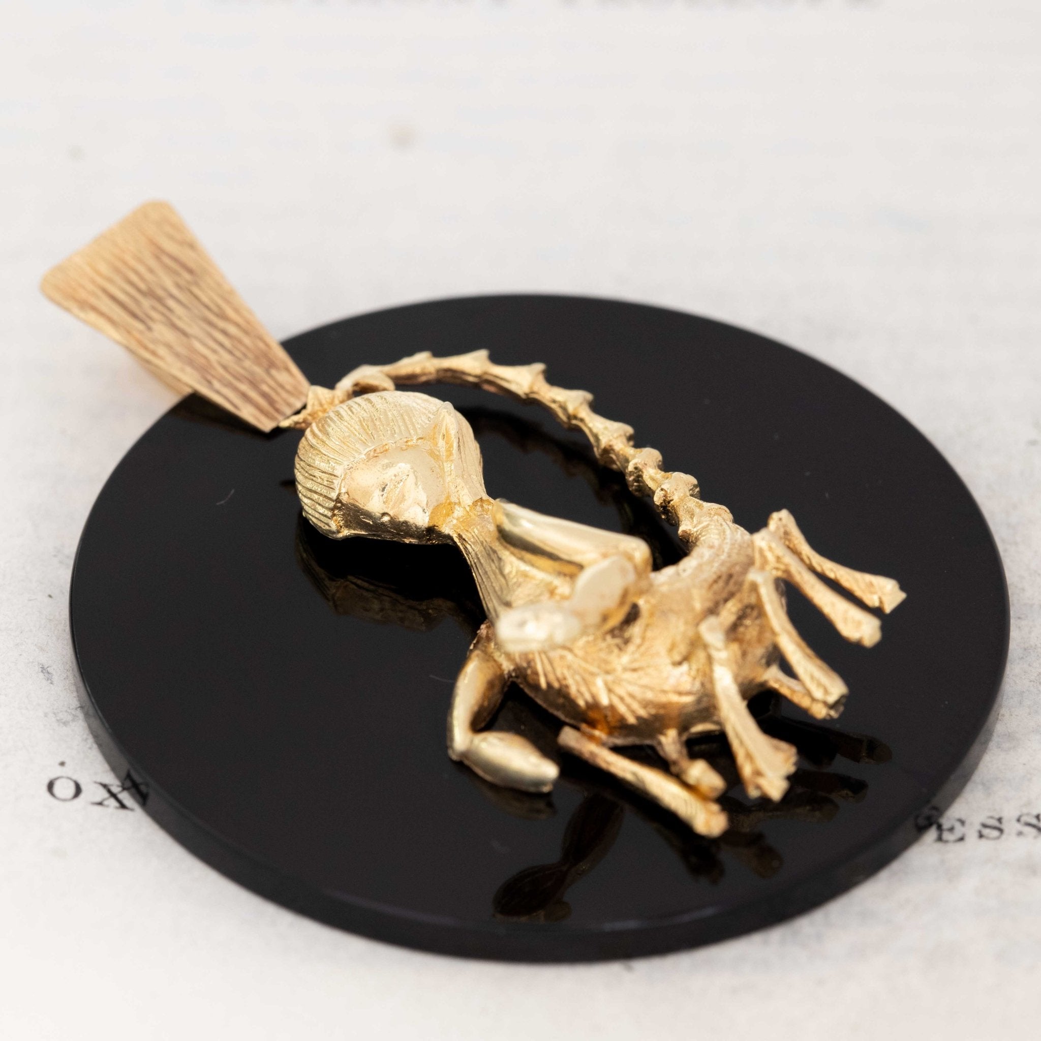 Mid-century black onyx pendant with gold scorpion figure