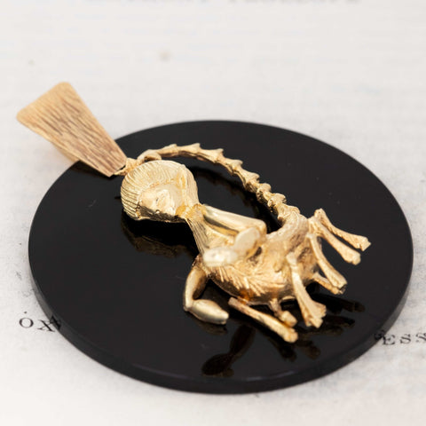 Mid-century black onyx pendant with gold scorpion figure