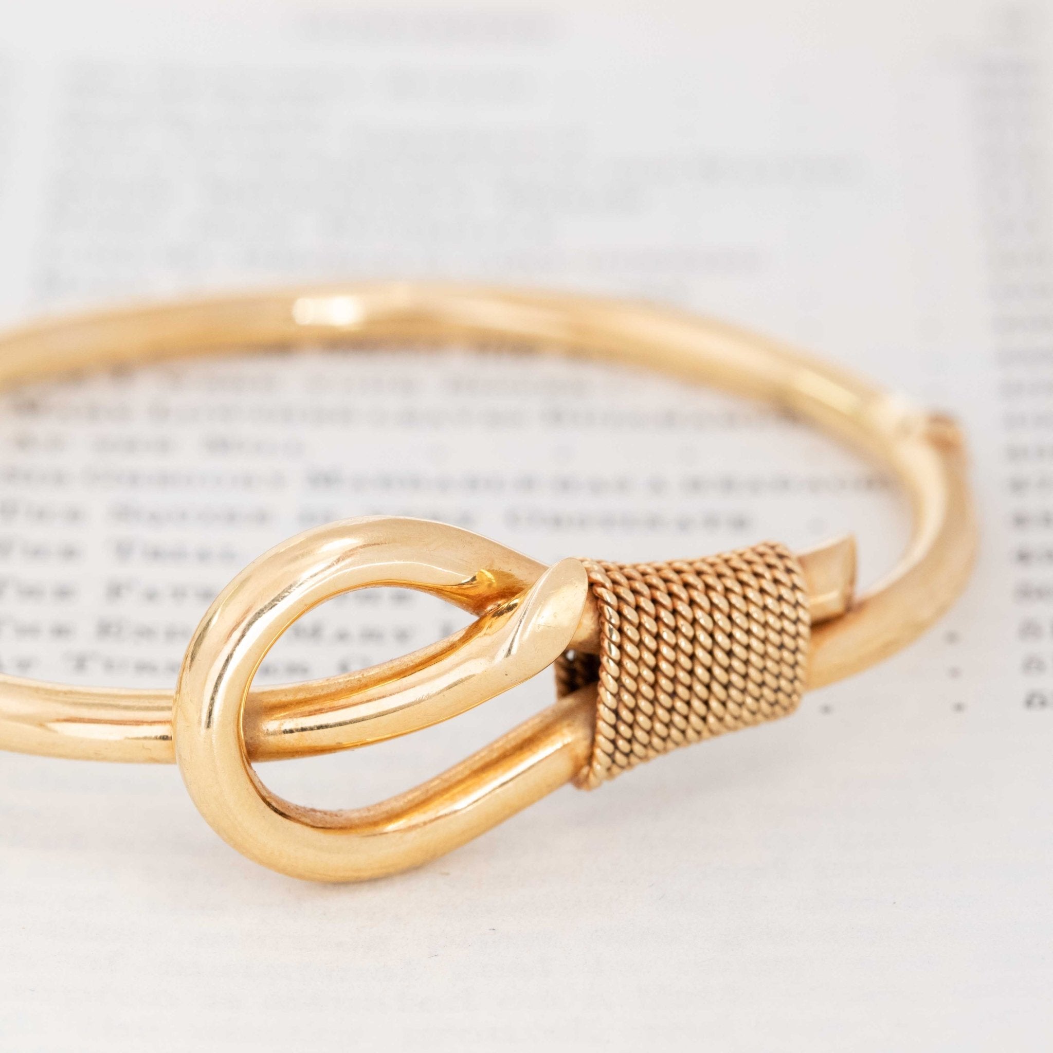 1980s gold bangle with knot motif