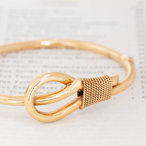 1980s gold bangle with knot motif