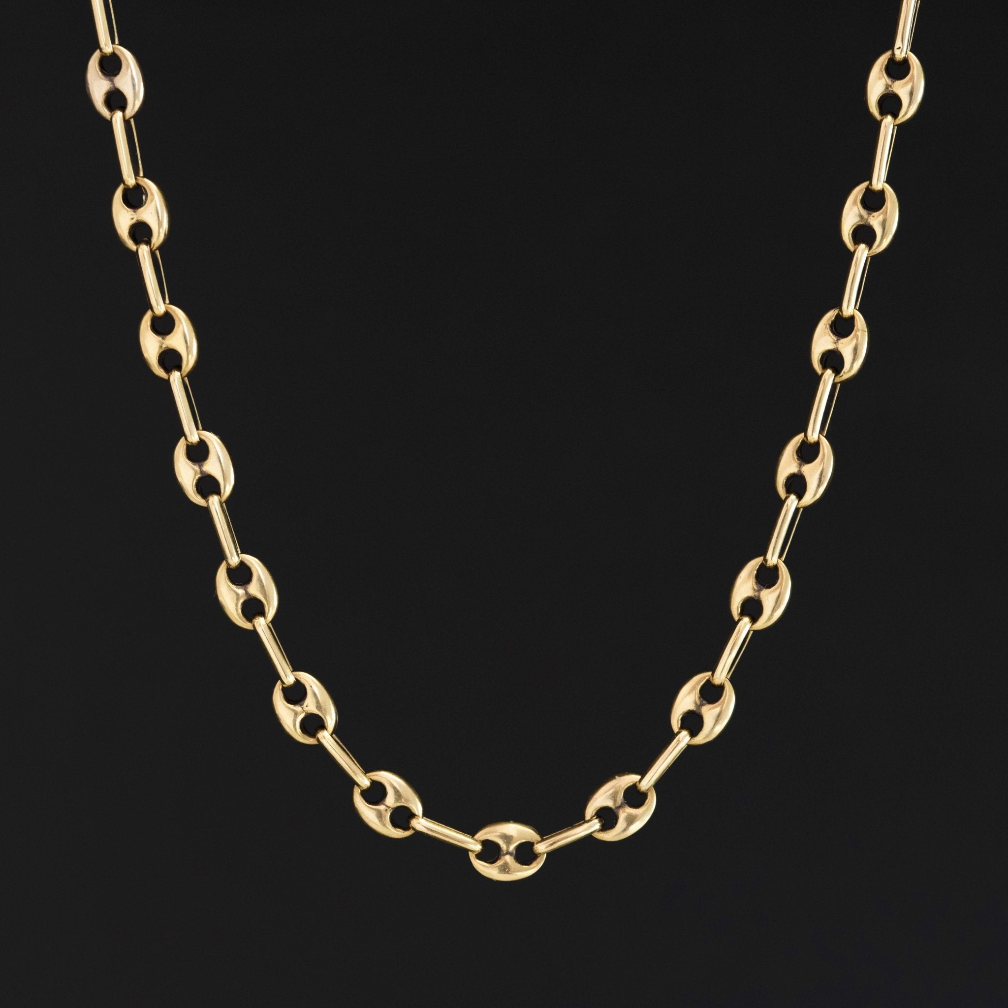 16-inch vintage mariner chain in solid yellow gold, 15 grams

Detailed view of Italian 14kt gold anchor link necklace, vintage fine jewelry