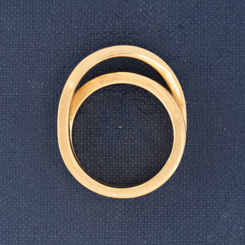Elegant vintage Cartier crossover ring in 18k gold with substantial, timeless style.