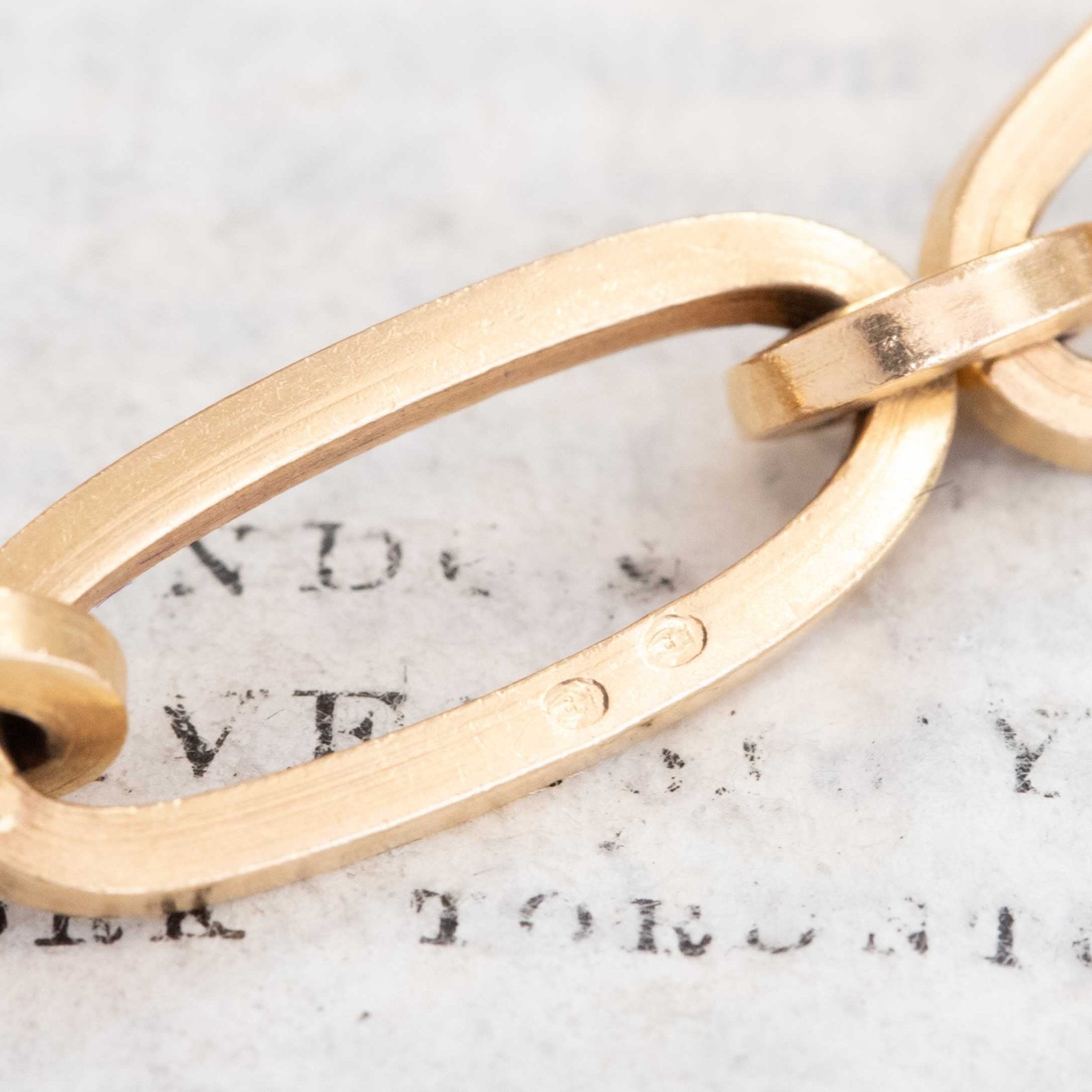 Detail shot: hallmark on link clasp, oval links design, vintage chain