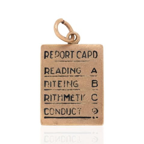 A Vintage yellow gold Report Card Charm
