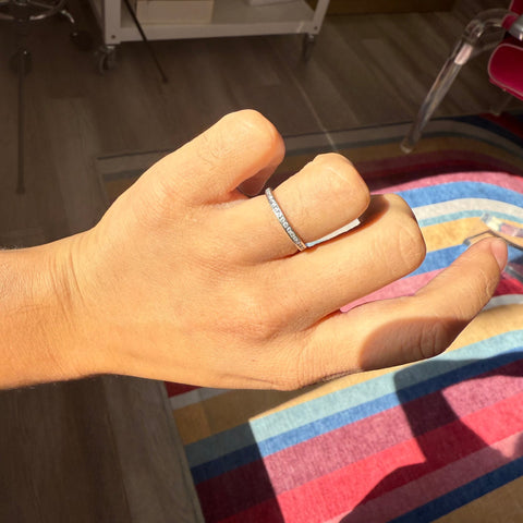 Tiffany & Co. vintage diamond eternity band in platinum shown on hand