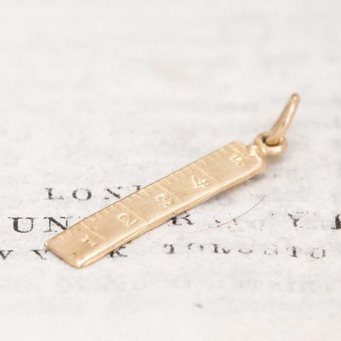 collectible gold ruler charm pendant