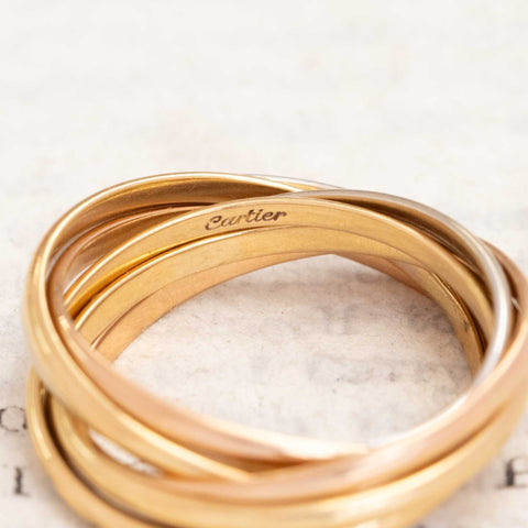 Cartier France Seven Rolling Ring close-up of mixed gold bands