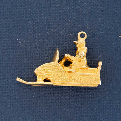 Vintage snow patrol figure with sled charm in 10kt yellow gold